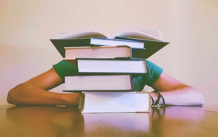 Student with stack of books