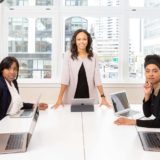 Group of business people looking in expectation towards the viewer